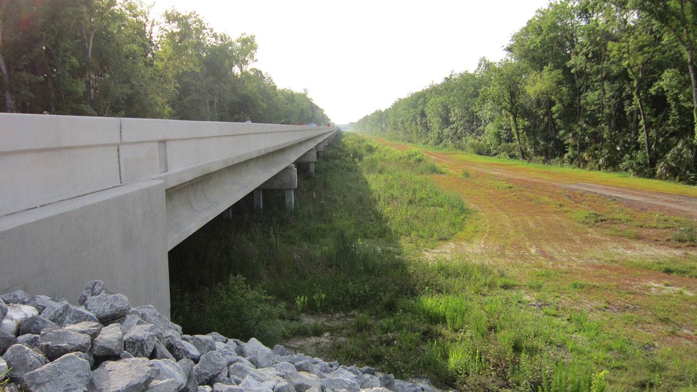 By elevating the preceding and proceeding roadways by five feet, traffic should only be minimally impacted by heavy rainfall.