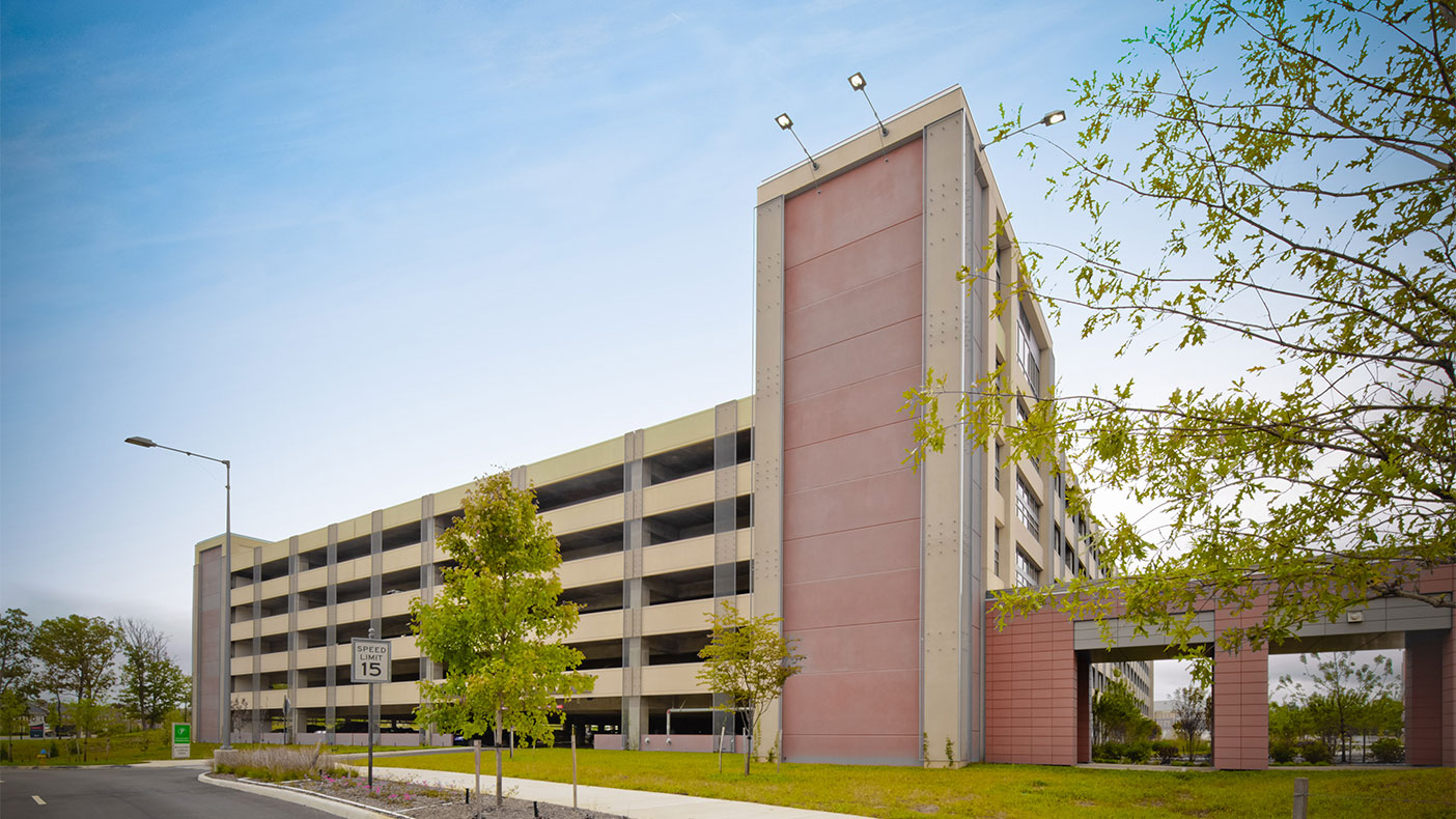 Two parking structures for 3,000+ vehicles and close to two miles of roadways were completed to support the community hospital.