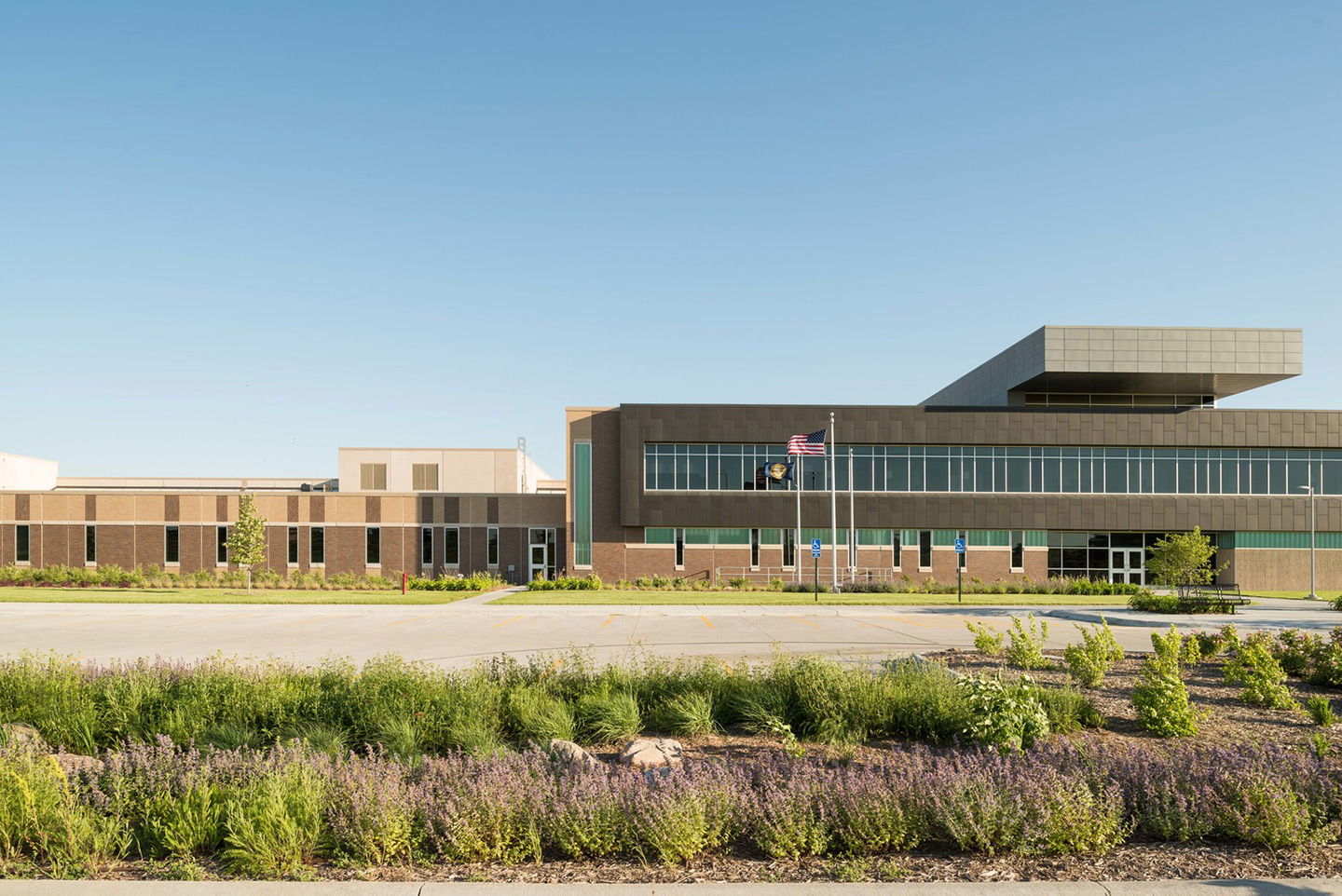 The facility is designed so the public, non-institutional façade faces the street, with the housing units in the rear, away from public view.