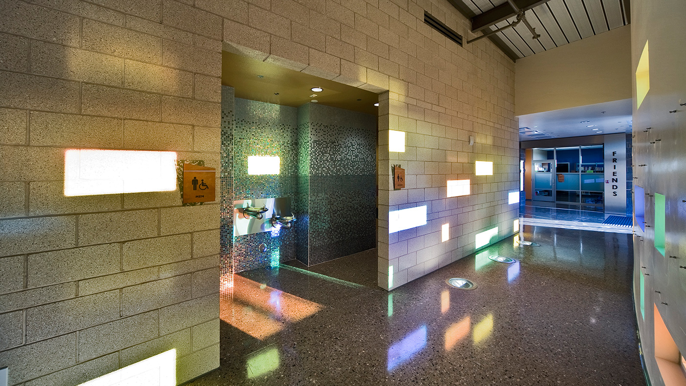 Facing south, design of the entrance lobby, which leads to community meeting rooms, uses the strong Arizona sun to create interesting patterns within this traditional space.
