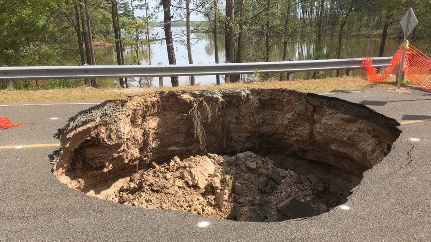 The report included supporting calculations for flow, volume, preferred sediment loss, site photos, vicinity map, detour map, typical section, cost estimate, and a roadway plan and profile sheet.