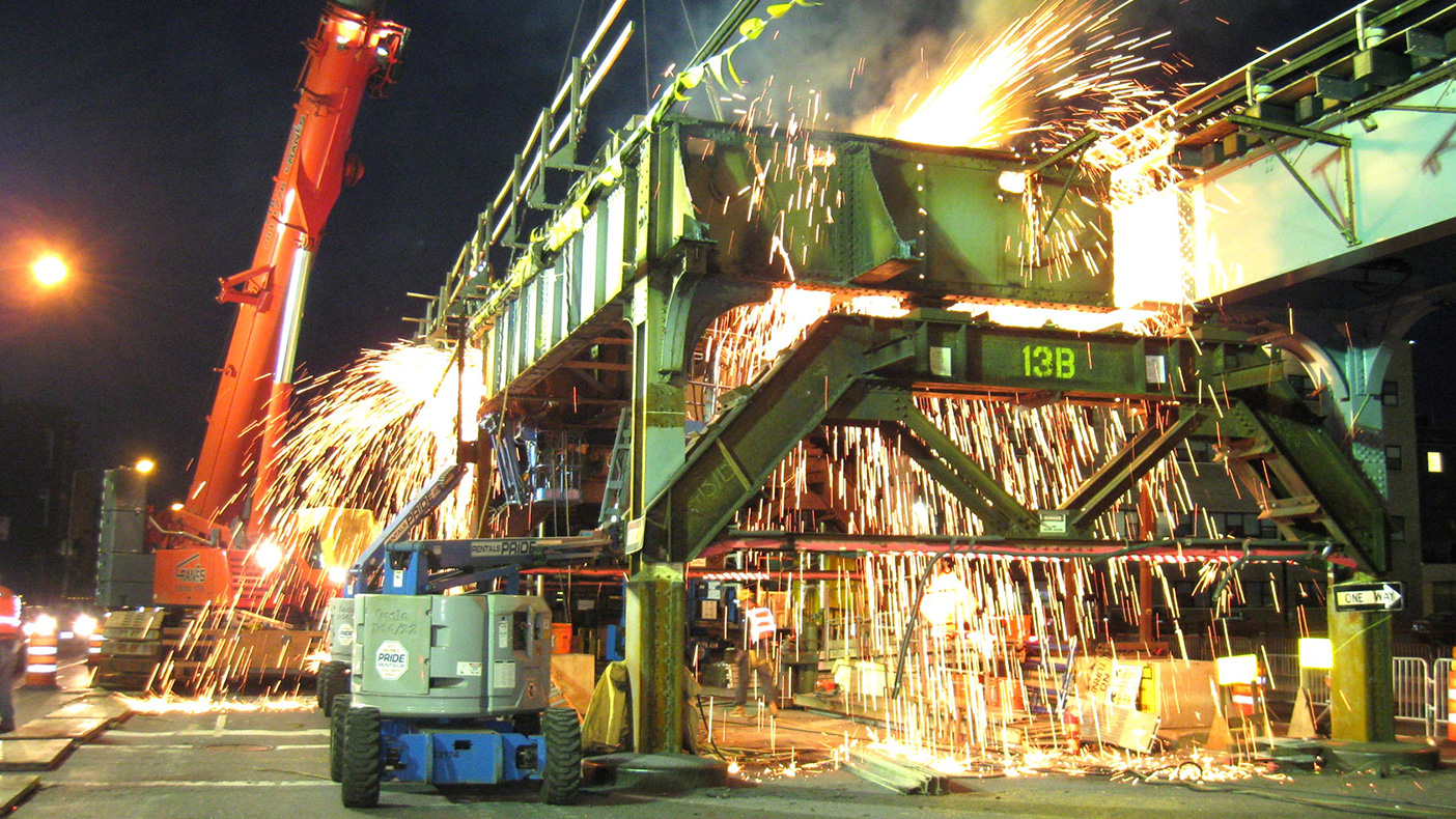 A typical span replacement included cutting the existing cross beam, girders and top portion of columns; then a new pre-fabricated span was installed by crane.