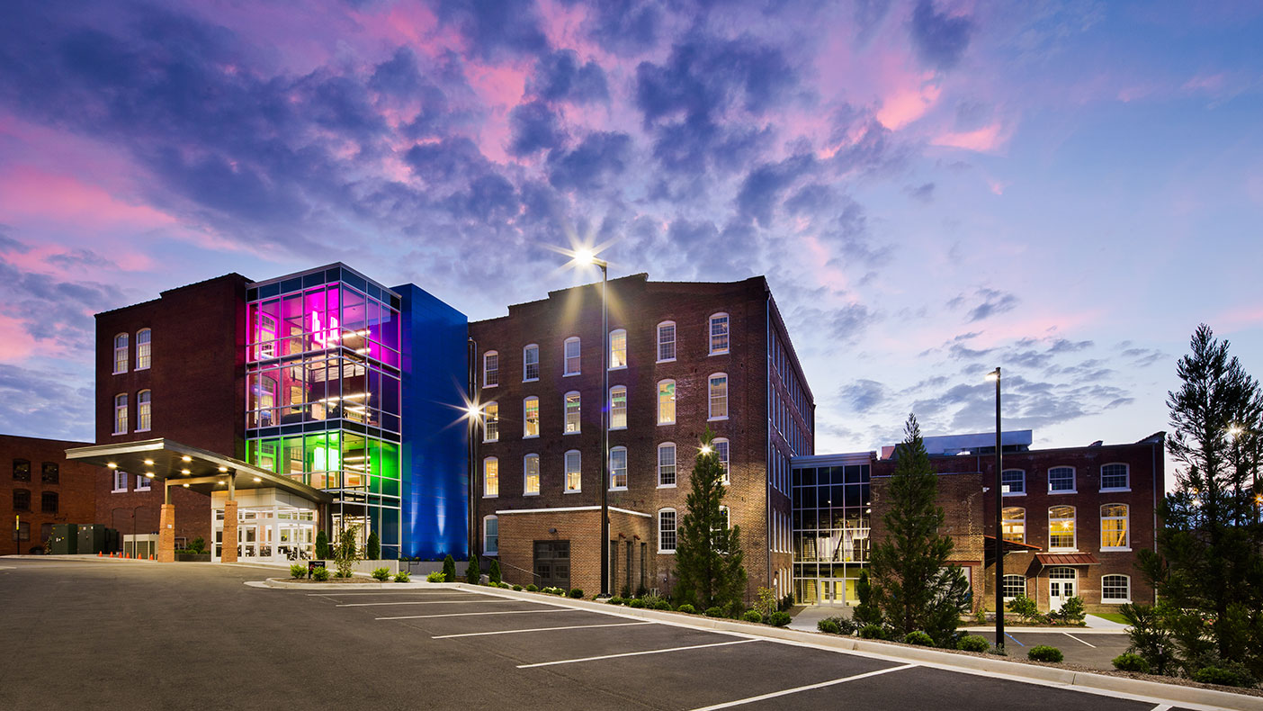 A tall glass tower was designed to highlight entry points into the facility while enhancing the exterior textures.