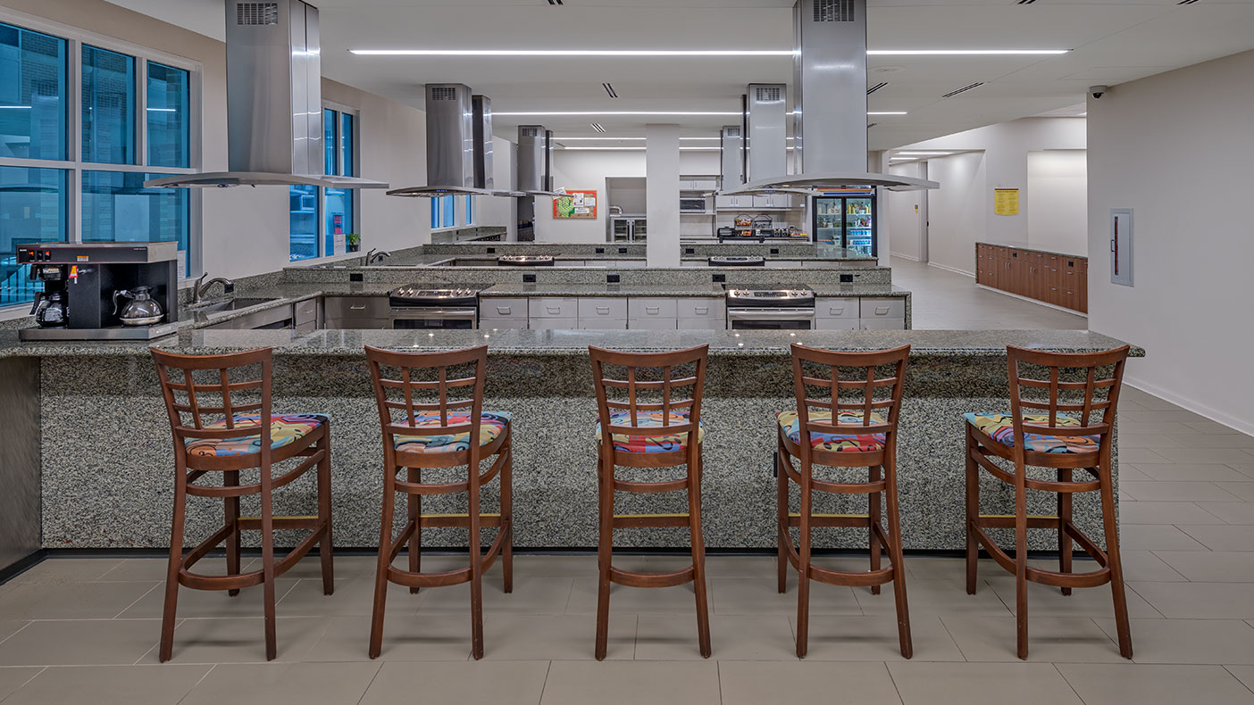The kitchen, living, and dining areas of the existing building were renovated, expanded, and updated.