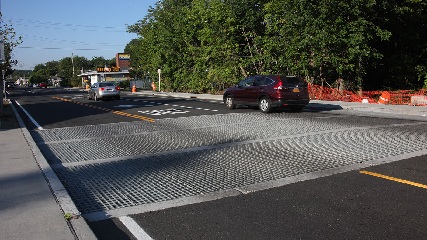 The project also included construction of 24-foot wide transverse roadway grate inlets (in a unique structure classified as a bridge) to redirect excessive stormwater away from the roadway's low point. Photograph by L.K. McLean Associates