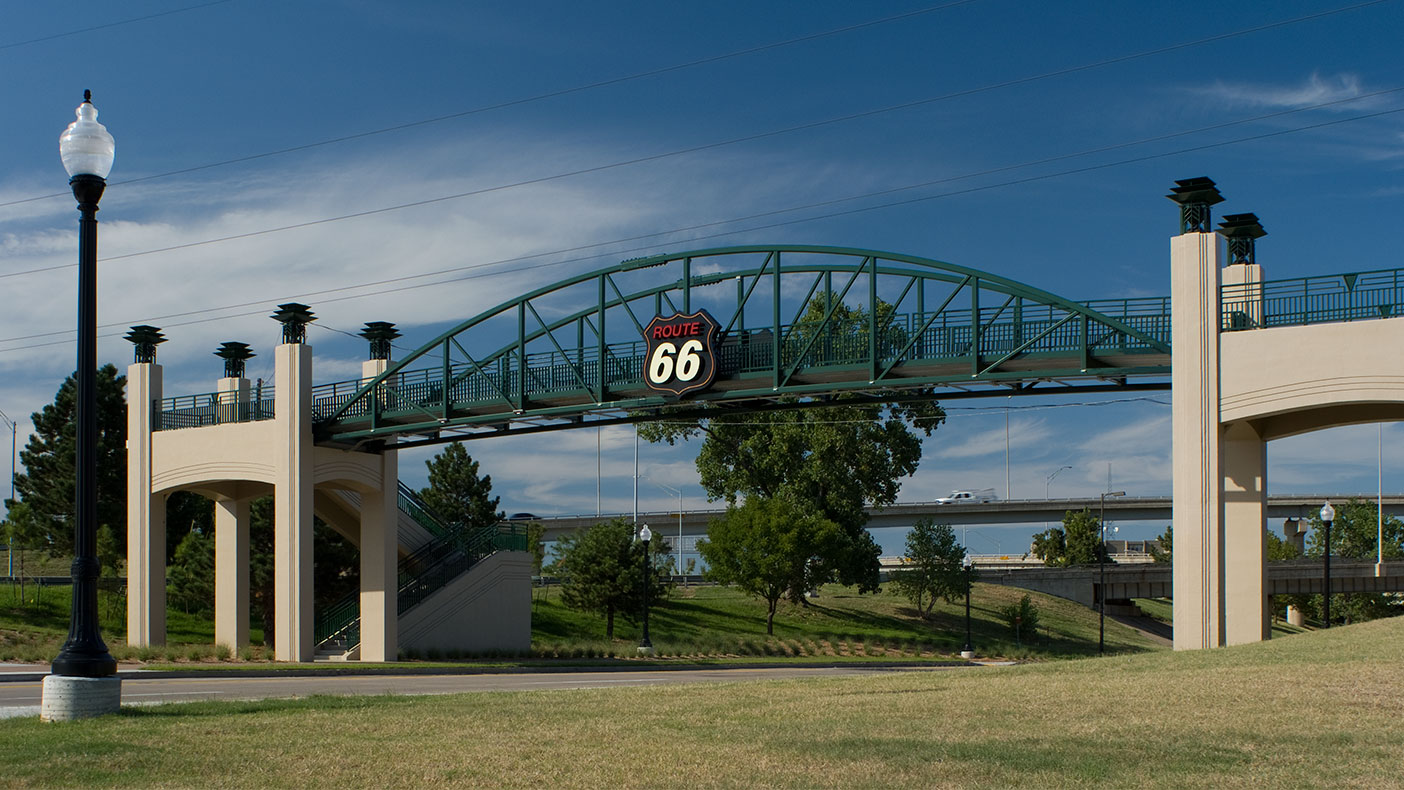 The pedestrian bridge over Southwest Boulevard connects visitor parking to the Cyrus Avery Centennial Plaza and provides an overlook for visitors.