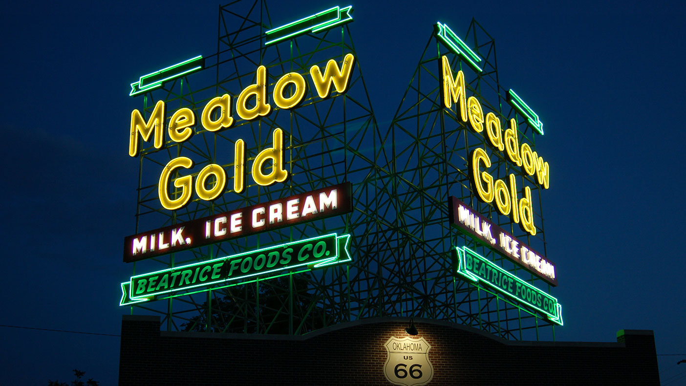 Kiosks inside the Meadow Gold sign plaza contain historical information about the sign, its preservation story, and details the restoration of the largest neon sign on Route 66.