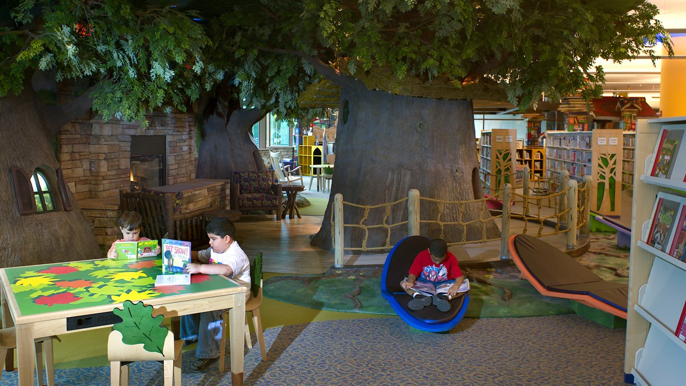 The children’s area features a storybook castle, a dragon’s cave, a space station, and a tree house.