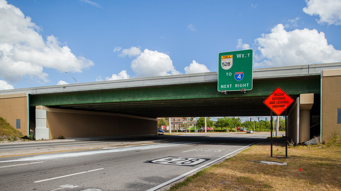 We widened the existing SR 528 bridge over Conway Road to accommodate the new plaza, and a new bridge was constructed over Daetwyler Drive.