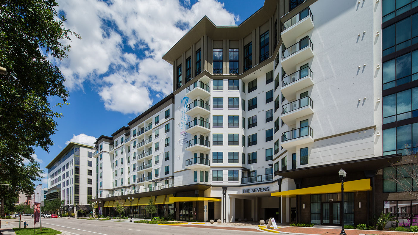 The development includes a parking garage accommodating more than 600 onsite parking spaces, offsite parallel spaces, an onsite loading/unloading zone, trash compactor enclosure, and an exfiltration system for stormwater treatment and attenuation.