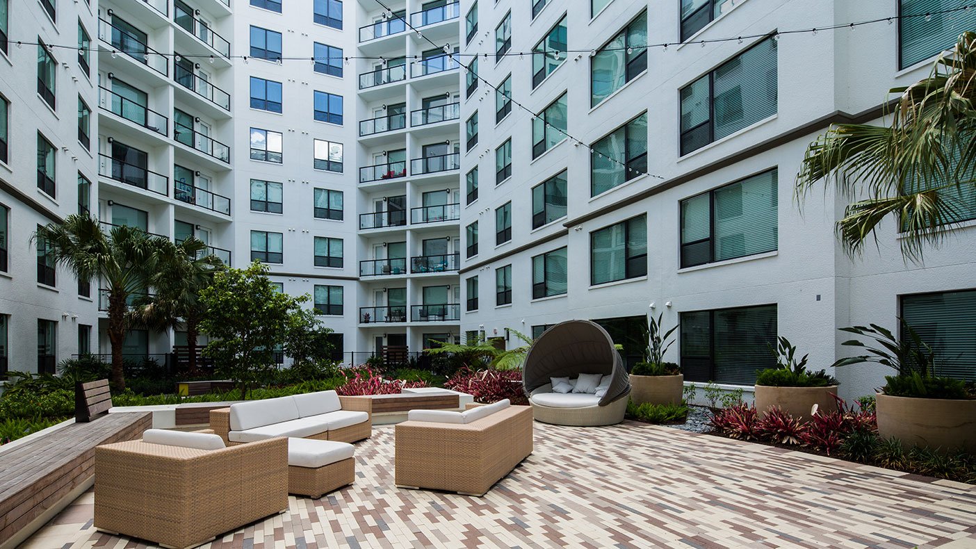 The Sevens includes interior and exterior courtyards, patio, grill, and a dog park.