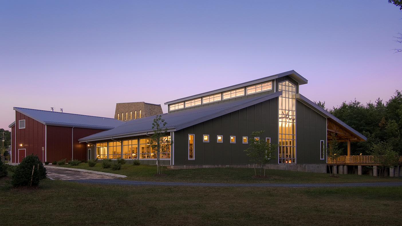The southwest elevation of the library is contemporary while sensitive to the agricultural nature of the area. Interior spaces were also designed to recall elements of local agrarian structures such as barns, sheds, and covered bridges.
