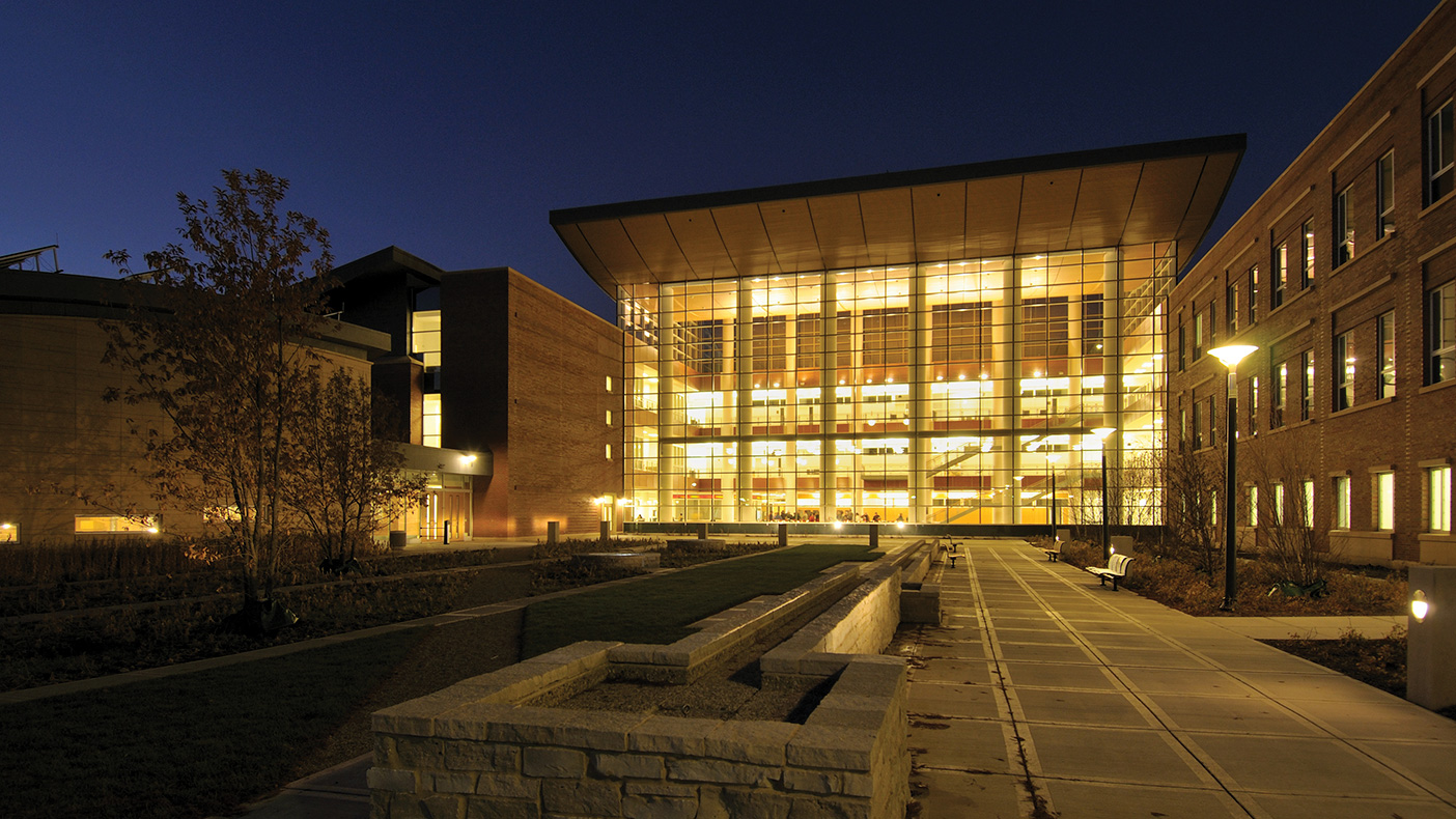 A bright, open pavilion highlights the building, now a prominent landmark on the Urbana campus. Photo: Courtesy of the College of Business at ILLINOIS, Business Instructional Facility