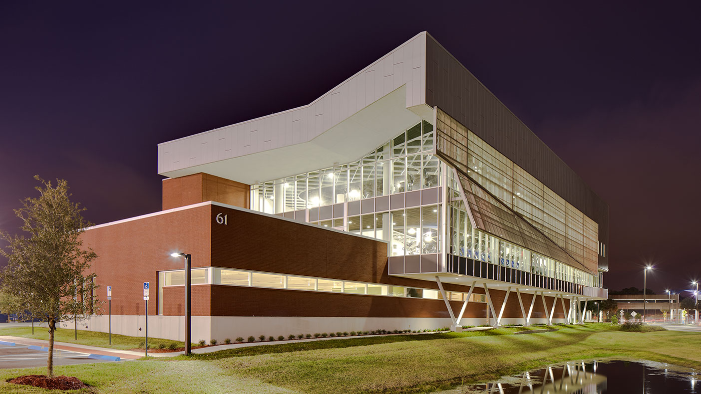 Large expanses of glass showcase the activity of the building and are layered with metal sun screens that protect against Florida's climate.