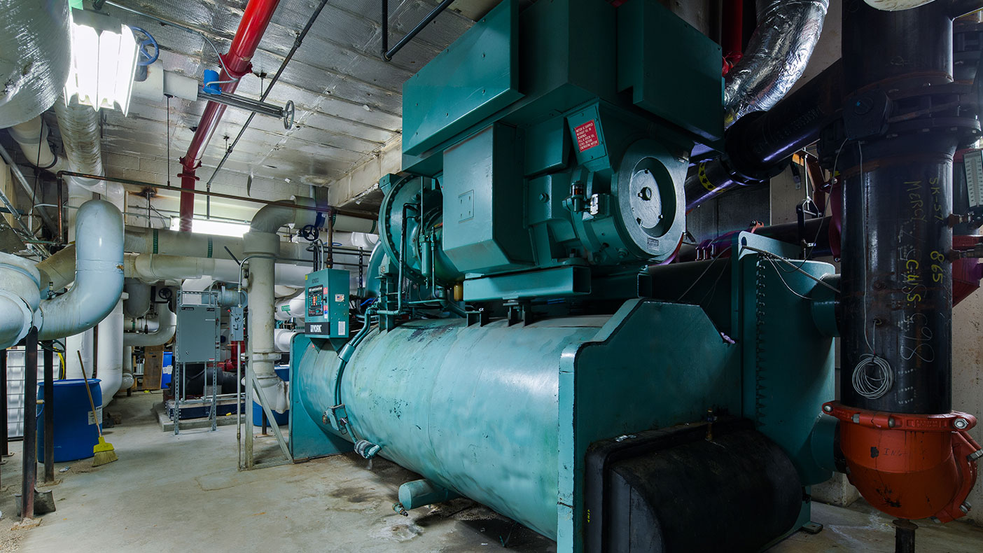 We optimized the chiller plant by automatically staging five chillers, pumps, and cooling towers and programming chilled water system supply setpoints to reset based on downstream AHU valve positions.
