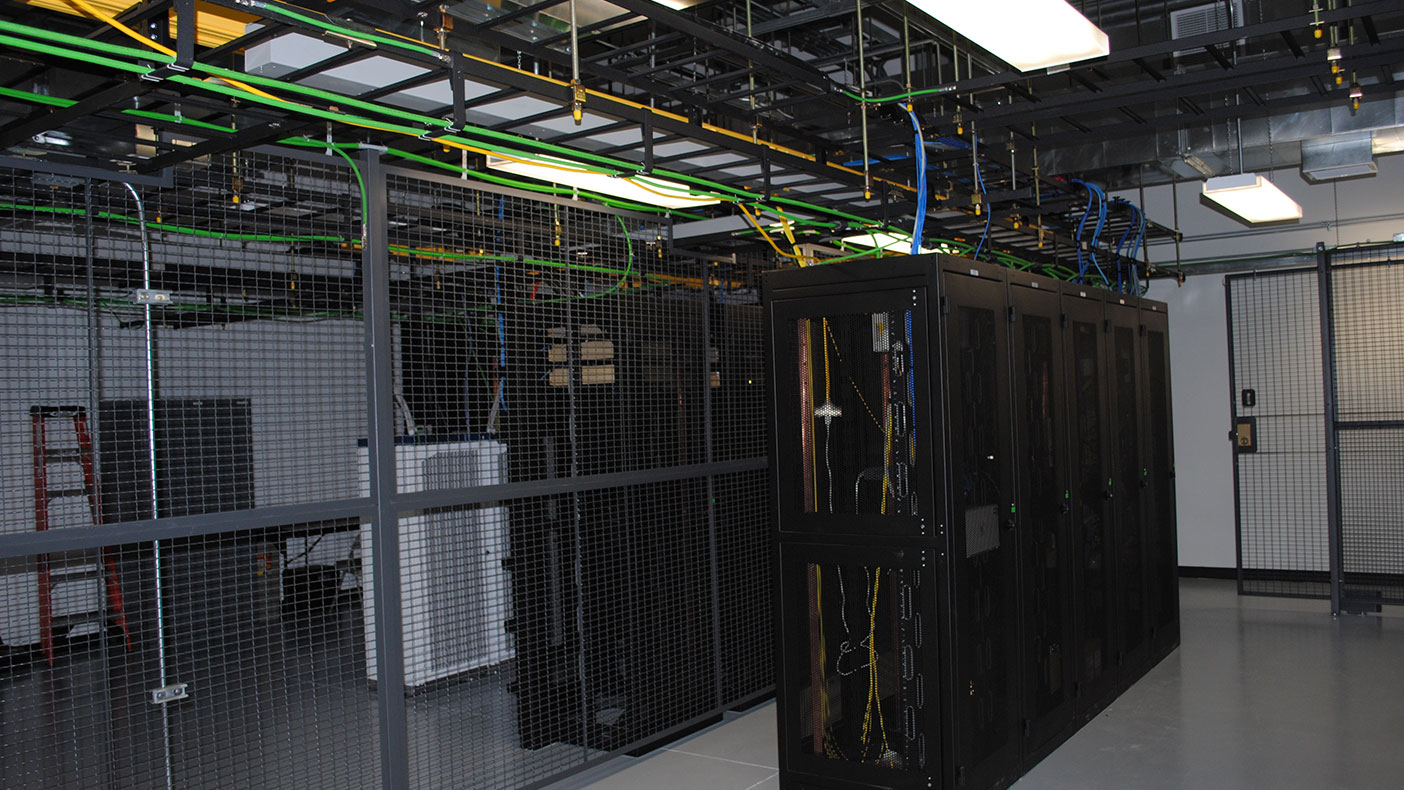 The two 30-ton HVAC units mounted on the roof have insulated supply and exhaust ducts that run down through the building to the data center's ceiling, maximizing floor space needed for future network expansion.