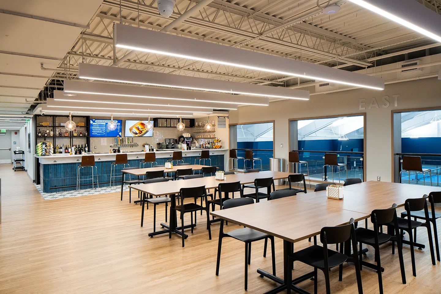 The modern restaurant, bar, and dining areas facilitate conversation and community building.