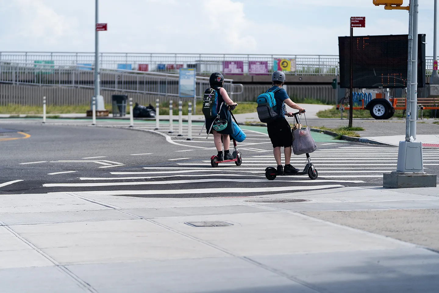 Scooter-riders using one of the new crosswalks on their way to the beach.