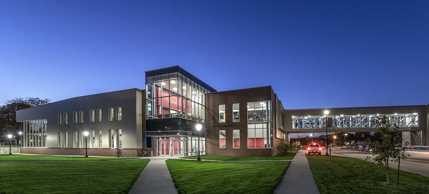 Kohawk branding highlights the entry which is flanked by the athletic weight room (left) and the fitness center and bridge (right).