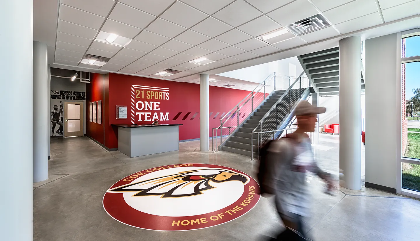 The south entry provides quick access to the wrestling and athletic weight rooms with fitness space above.