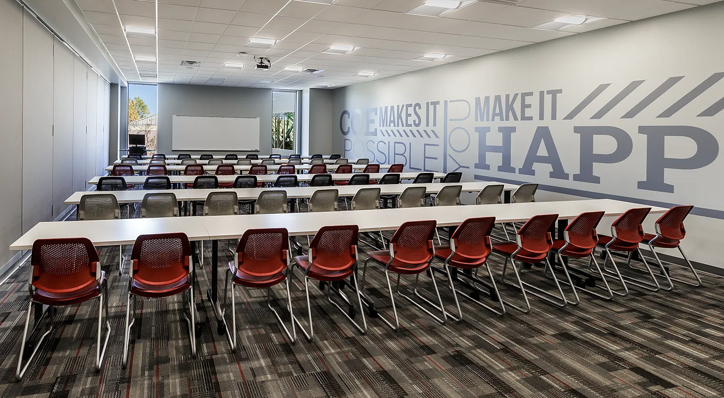 The upper classrooms can be opened to form one large room that accommodates the entire Kohawk football team.