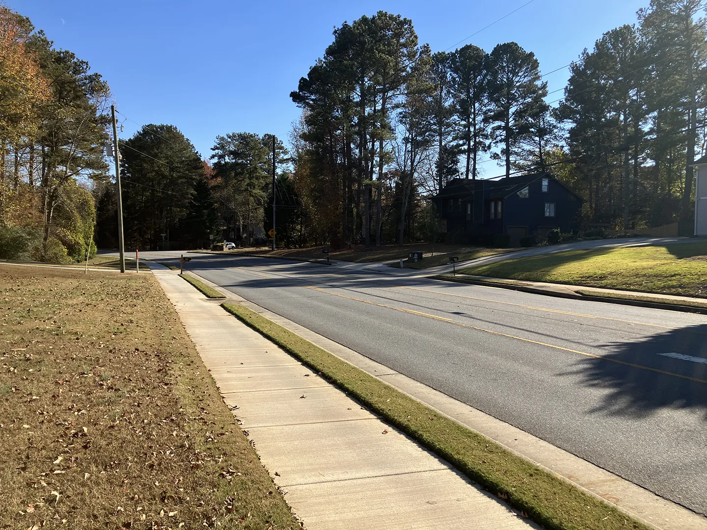 Sidewalk improvements along Old Peachtree Road safely increase pedestrian mobility and connectivity for Gwinnett County residents.