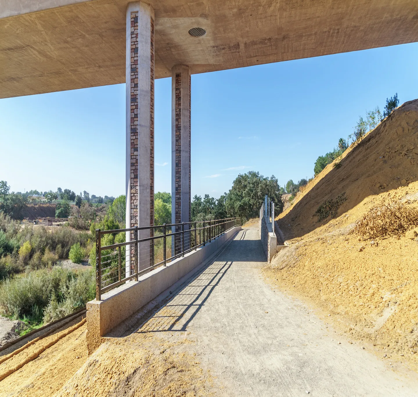 Walkways were incorporated underneath the bridge to provide a public park for the community. This also aids with the protection of animal species in the area.