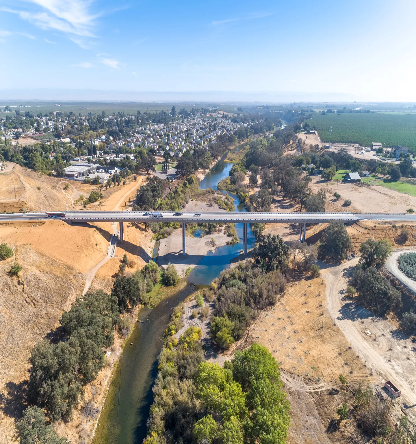 An increased height of 75 feet over the Tuolumne River allows for better protection from flooding and erosion.