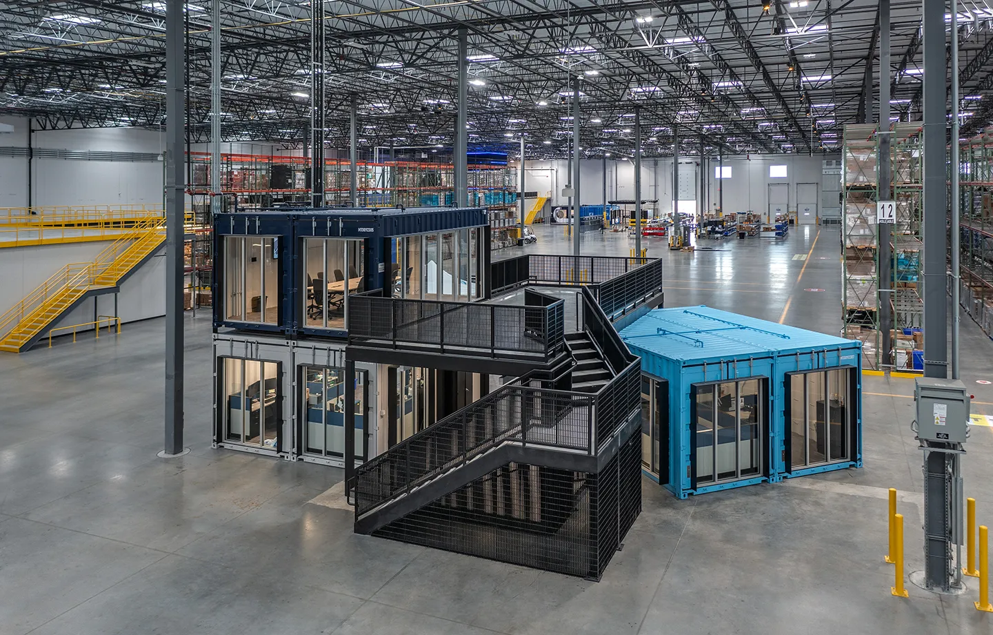 Our team incorporated modified shipping containers for warehouse floor staff offices and conference rooms so that they can be relocated to a new lease space when needed.