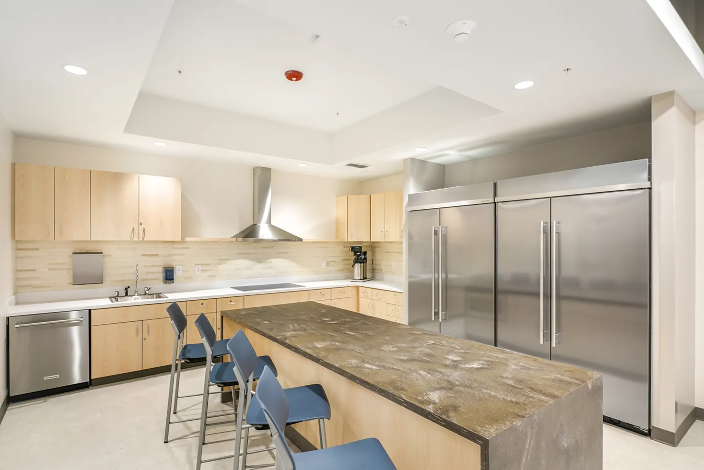 Common rooms, like the break room, contain hard floors and durable finishes as requested by the project’s stakeholders.