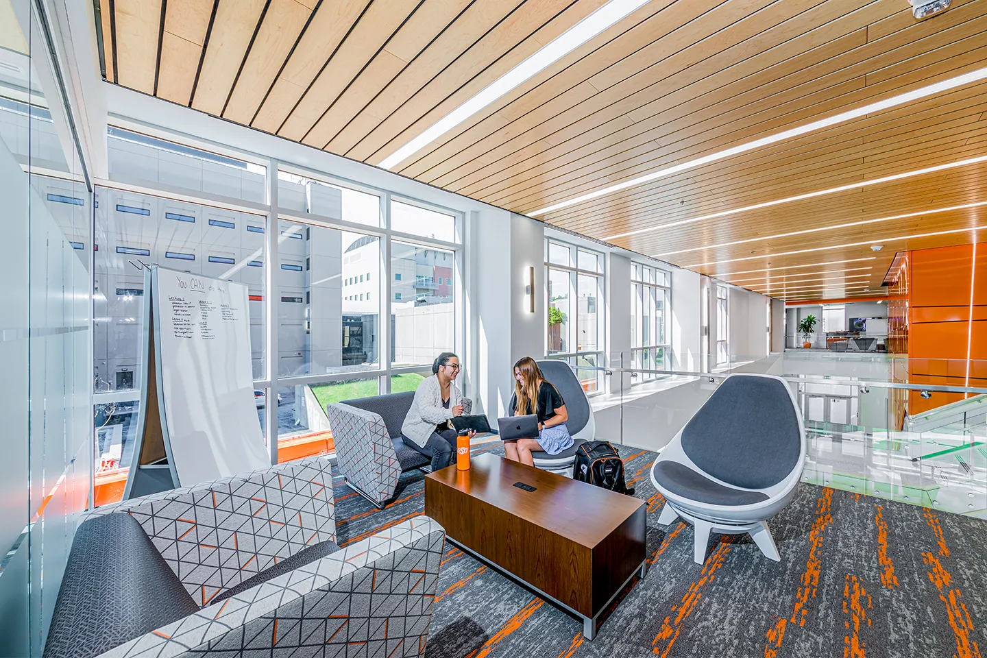 Comfortable pocketed spaces for study and collaboration are found throughout the North Hall Academic Building, taking advantage of natural light harvested from the interior lobby using a multi-floor clerestory design.