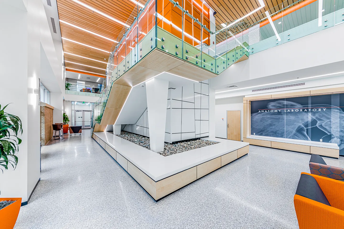 The interior design incorporates biophilic advantages of natural light, accessibility, acoustics, clean air, and other wellness amenities, such as the central stair focal point enticing users to bypass the elevator.