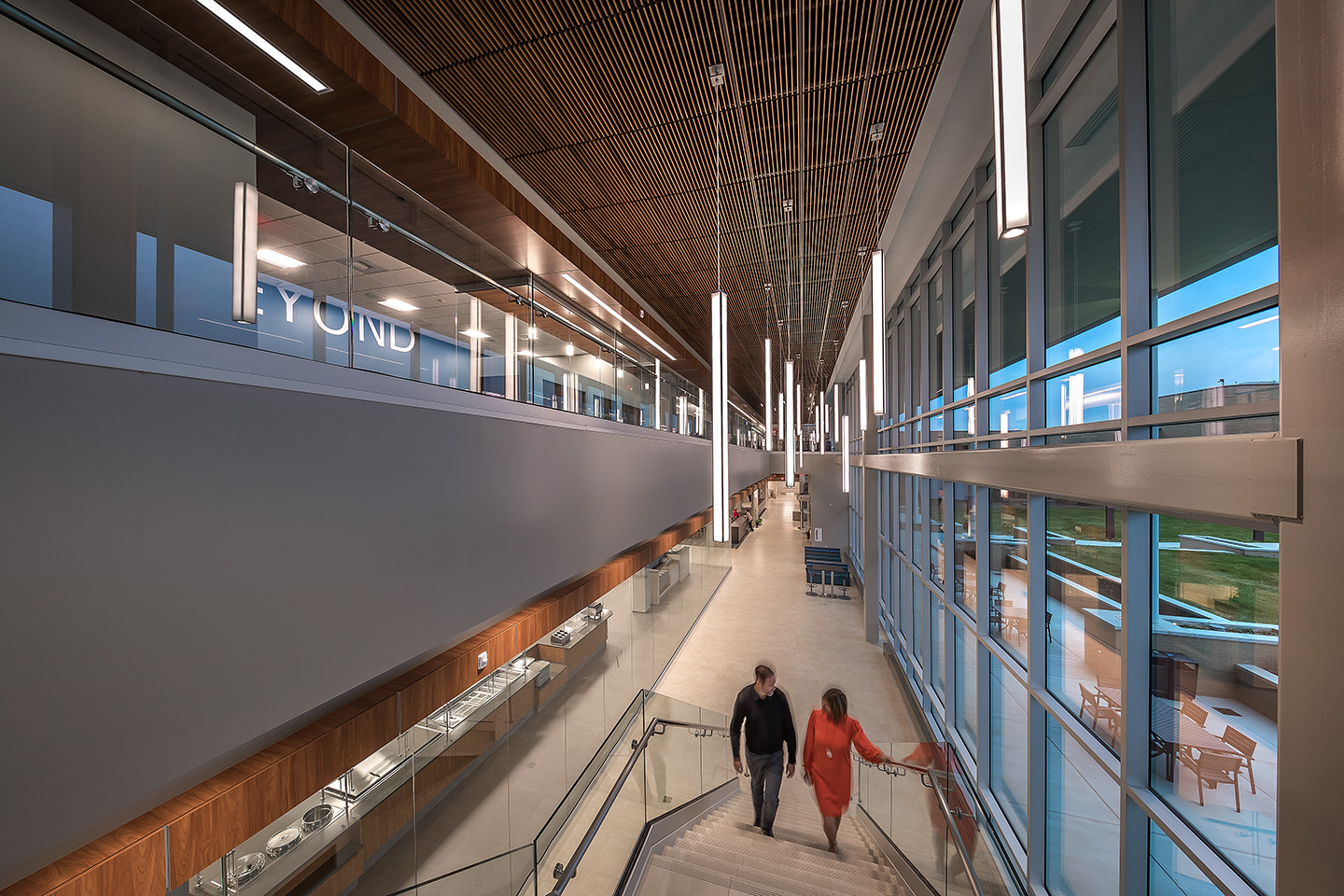 The monumental stair connects the informal workspace and work café at the lower level to the second-level training and flexible workspaces.