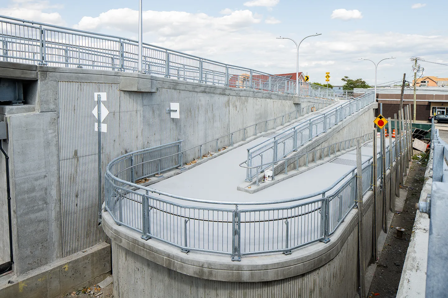 An existing pedestrian ramp at the south end of the Cross Bay Veteran Memorial Bridge was replaced with a new ADA-compliant ramp.