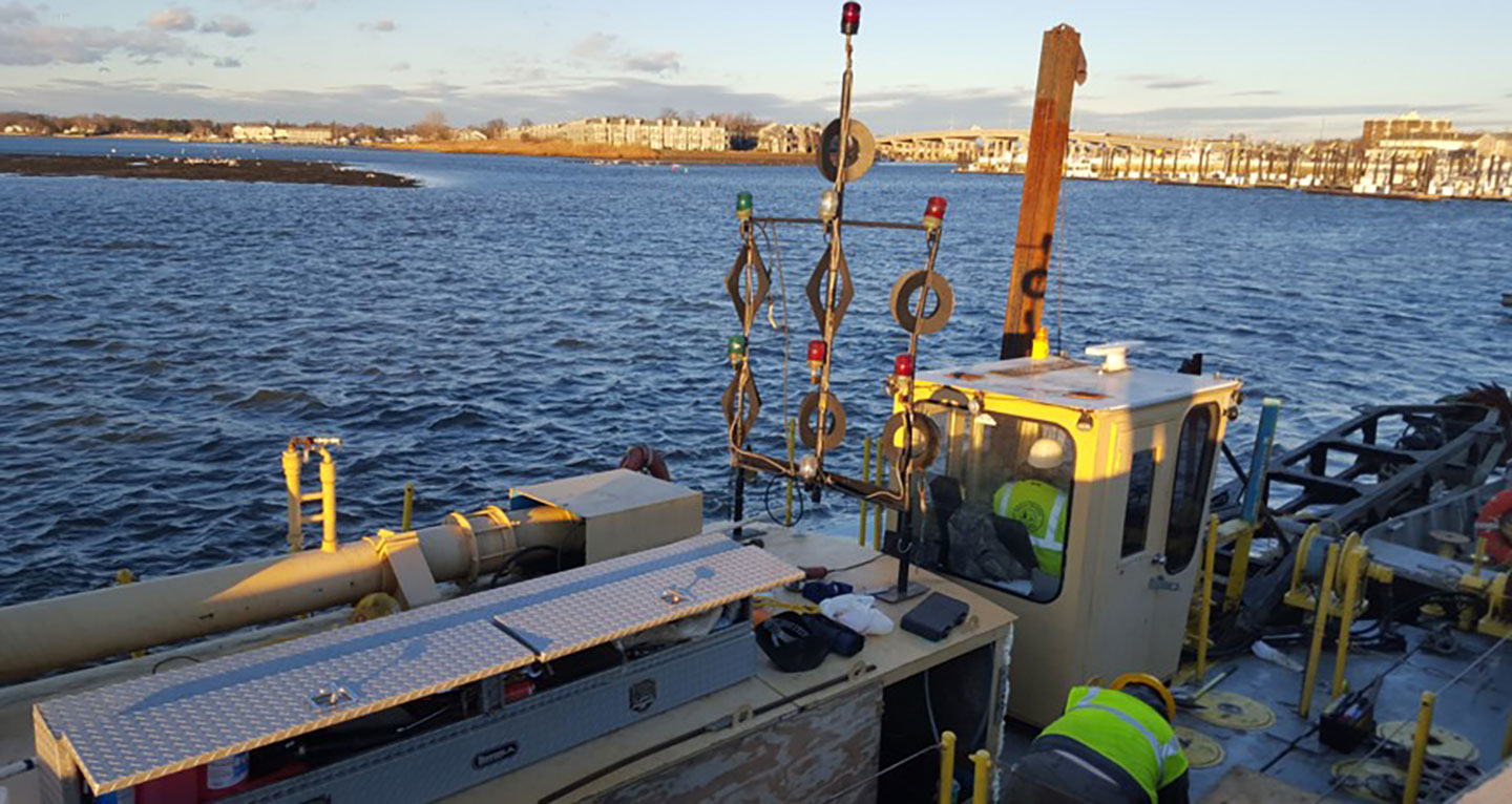 The dredge pipeline was floated, except at channel crossings where it was submerged to avoid a hazard or hindrance to navigation.