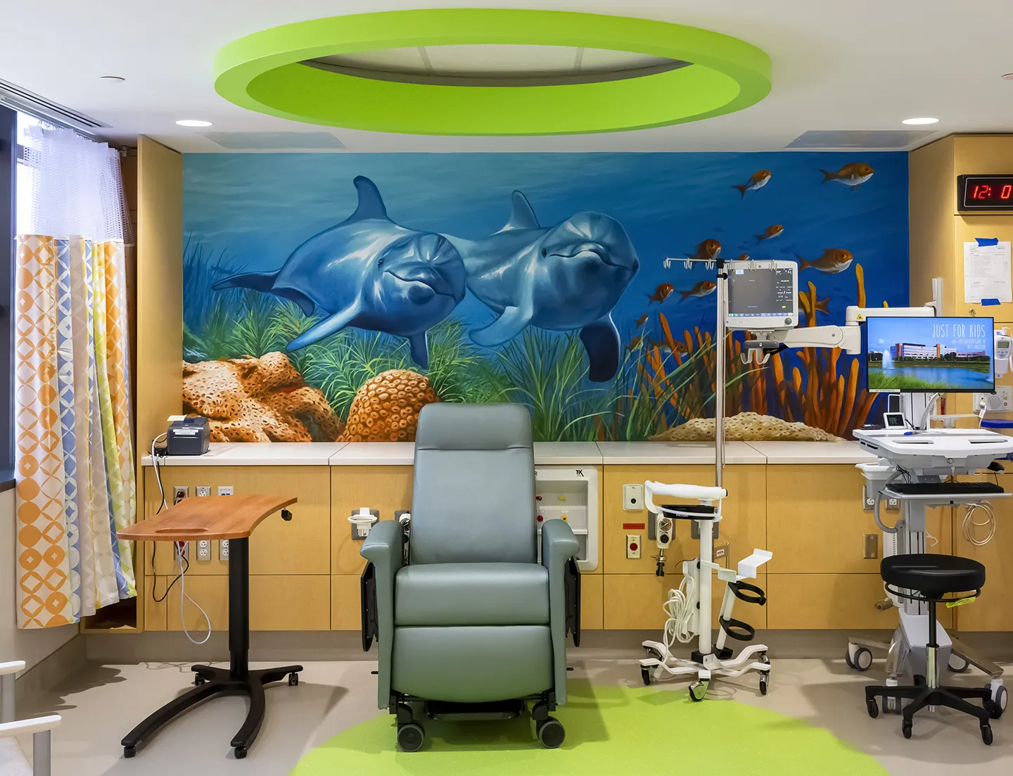 Underwater-themed murals create a welcoming and child-friendly space for patients.