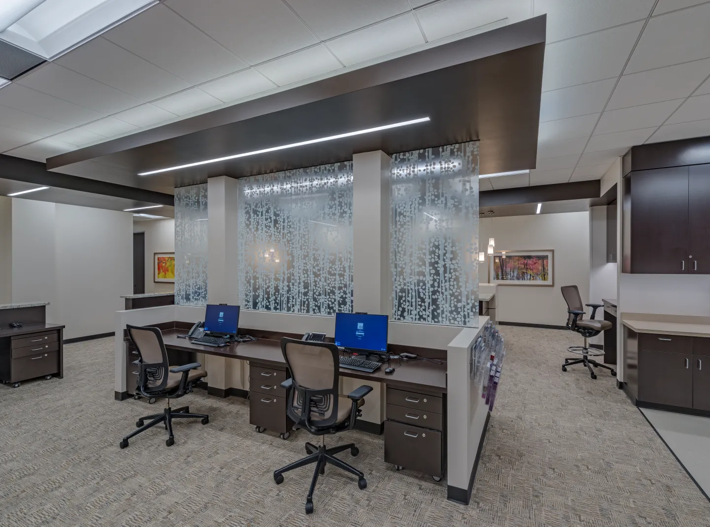 Staff workstations with privacy glass.