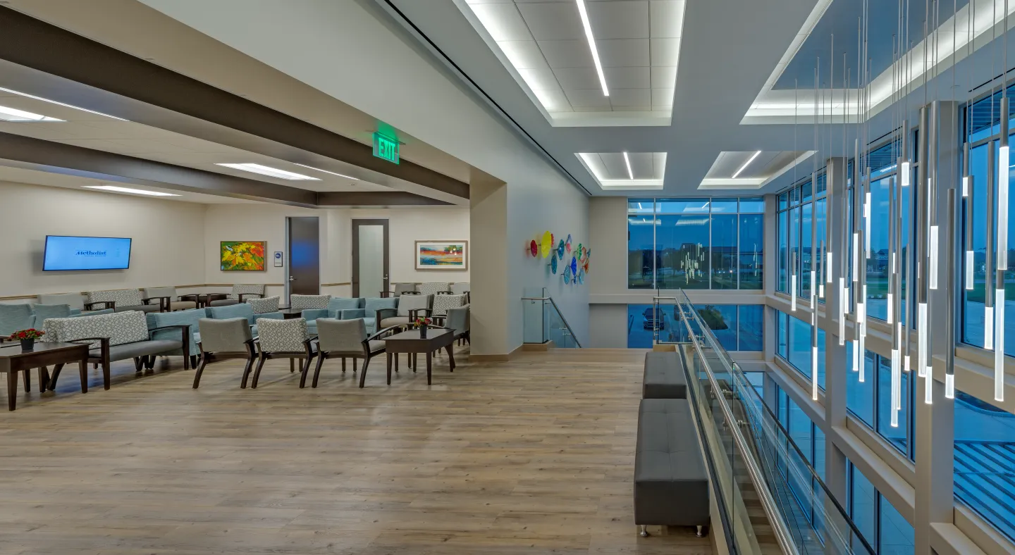 The waiting room opening to the dedicated atrium and elevator lobby.